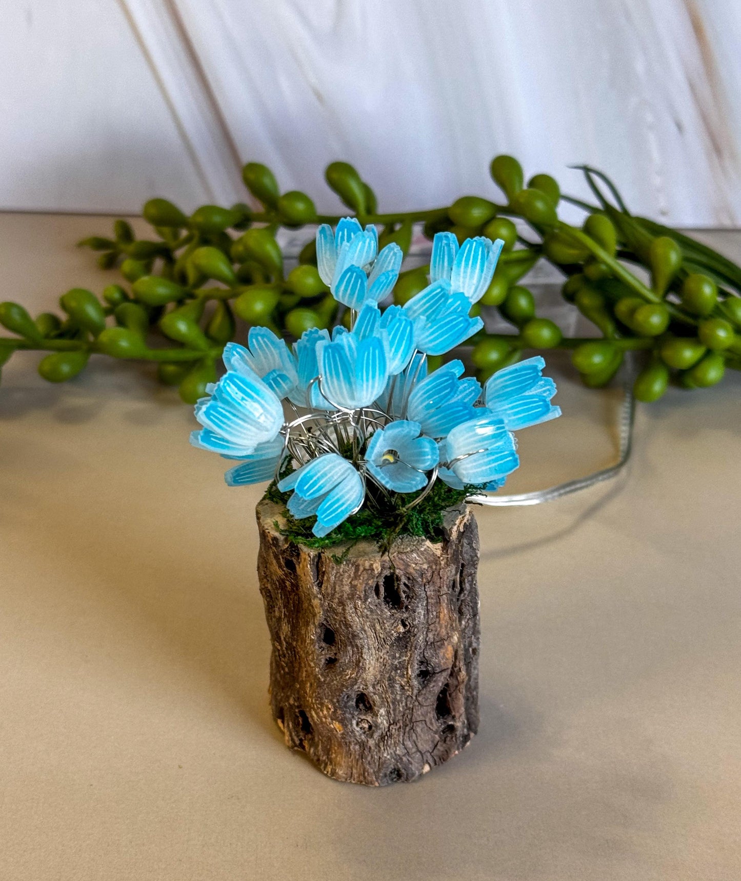 Fairy garden with tulips and fairy lights